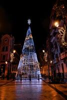 Christmas decorations at night in Alicante city photo