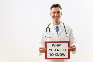 Image of doctor holding paper with text what you need to know photo