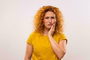 Ginger woman is having toothache photo