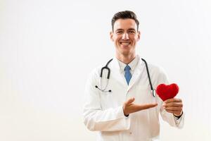 Portrait of doctor with stethoscope showing heart shape photo