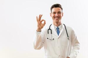 Portrait of young doctor showing ok sign photo