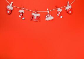 winter garland Christmas decoration on red background. photo