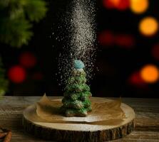 Christmas composition. Gingerbread spruce. Christmas wreath. Against the background of blurred festive garlands.selective focus. High quality photo. photo