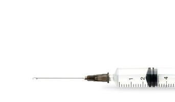 injection syringe with medicine on white background. selective focus. isolated on white background photo