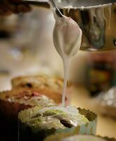 The chef hands adorn the cupcakes with icing sugar and slices of sugar. background blurred, selective focus.High quality photo