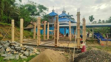 Kuaro Kalimantan Timur, Indonesia 24 November 2023. some builders are building a mosque photo