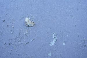 White peeling paint wall surface with moldy.Weathered concrete pattern wall.Old white color painted peeling off moment to do can see raw concrete texture wall.Swelling concrete wall texture. photo