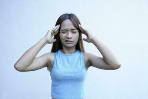 Asian woman has a headache Stressed from work photo