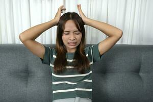 Asian woman stressed from unsuccessful work photo