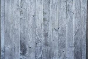 Beautiful wooden texture of horizontal multi-colored boards with knots on the wall surface. The background. Texture. photo