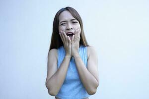 Asian woman has severe toothache photo