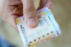 Man hand with indian rupees bills. Concept of financial operations in cash in India photo