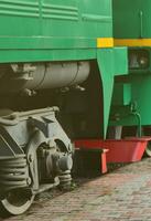 The wheels of a modern Russian electric train with shock absorbers and braking devices. The side of the cab photo