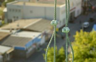 Rope lockers in of suspended wire rope platform for facade works on high multistorey buildings. Rope lockers blocks kink for safety platform usage photo