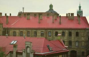 Fragment of a metal roof of the restored old multi-storey building in Lviv, Ukraine photo