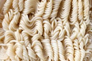 Instant cooking noodles macro texture in boiled condition photo