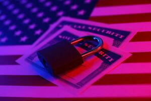 Padlock and social security card on United States flag. Identity theft and identity protection concept photo