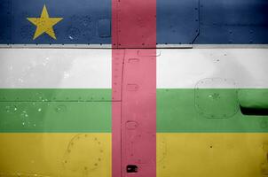 Central African Republic flag depicted on side part of military armored helicopter closeup. Army forces aircraft conceptual background photo