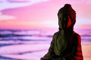 Buddha Purnima and Vesak day concept, Buddha statue with low key light against beautiful and colorful background. Meditation photo