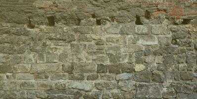 Large stone wall of an ancient castle in Lviv, Ukraine photo