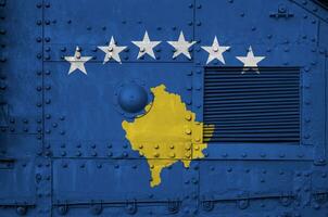 Kosovo flag depicted on side part of military armored tank closeup. Army forces conceptual background photo