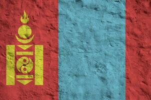 Mongolia flag depicted in bright paint colors on old relief plastering wall. Textured banner on rough background photo