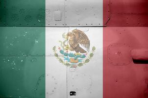 Mexico flag depicted on side part of military armored helicopter closeup. Army forces aircraft conceptual background photo