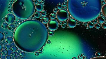 Abstract Colorful Food Oil Drops Bubbles and spheres Flowing on Water Surface video