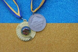 KYIV, UKRAINE - MAY 4, 2022 Medal for the person who conquered Mount Hoverla photo