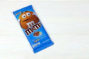 KHARKOV, UKRAINE - MARCH 15, 2021 M M's milk chocolate bar. M M's produced by Mars Incorporated photo