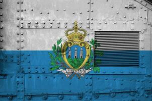 San Marino flag depicted on side part of military armored tank closeup. Army forces conceptual background photo
