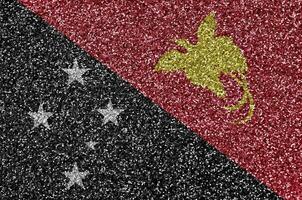 Papua New Guinea flag depicted on many small shiny sequins. Colorful festival background for party photo