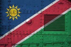 Namibia flag depicted on side part of military armored tank closeup. Army forces conceptual background photo