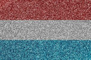 Luxembourg flag depicted on many small shiny sequins. Colorful festival background for party photo