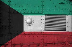 Kuwait flag depicted on side part of military armored tank closeup. Army forces conceptual background photo