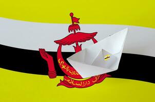 Brunei Darussalam flag depicted on paper origami ship closeup. Handmade arts concept photo