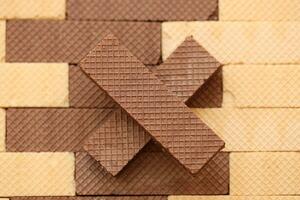 Stacked delicious chocolate wafers in large amount. Two different flavours of classic waffles photo