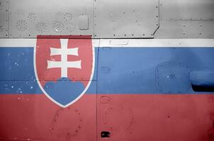 Slovakia flag depicted on side part of military armored helicopter closeup. Army forces aircraft conceptual background photo