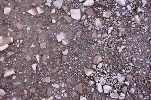 Background of shattered stony stones surface in mountain area. Texture with natural light photo