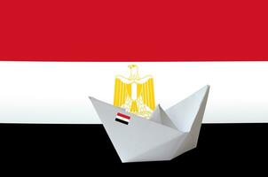 Egypt flag depicted on paper origami ship closeup. Handmade arts concept photo