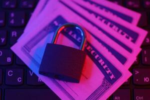 Padlock and social security card on computer keyboard. Identity theft and identity protection concept photo