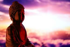 Buddha Purnima and Vesak day concept, Buddha statue with low key light against beautiful and colorful background. Meditation photo