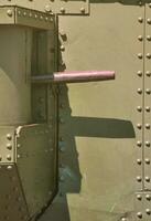 The texture of the wall of the tank, made of metal and reinforced with a multitude of bolts and rivets. Images of the covering of a combat vehicle from the Second World War with a guided machine gun photo