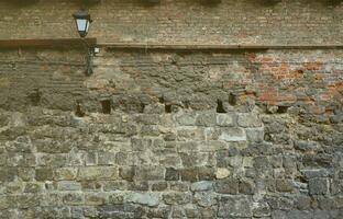 Large stone wall of an ancient castle in Lviv, Ukraine photo