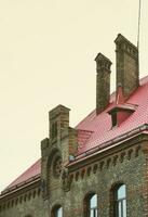 Fragment of a metal roof of the restored old multi-storey building in Lviv, Ukraine photo