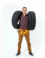 Auto mechanic with tools on a white background photo