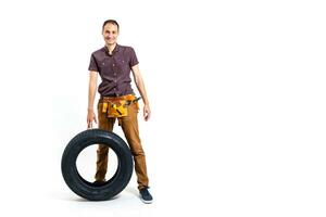 Auto mechanic with tools on a white background photo