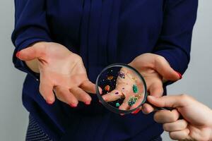 Hygiene concept. Man is showing dirty hands with many viruses and germs. photo