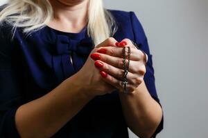 Closeup portrait of a young woman praying photo