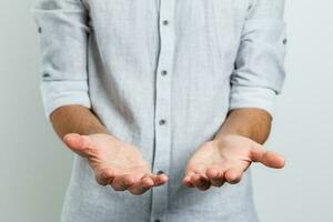 Open palm hand gesture of male hand.Isolated on white background. photo